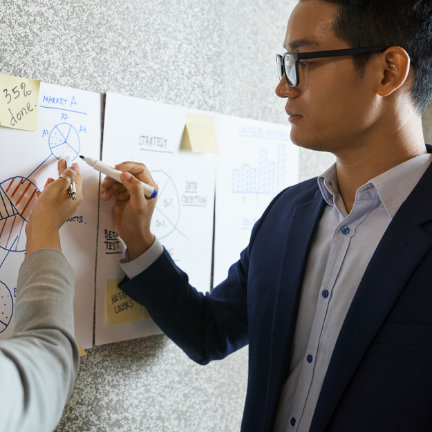 business people discussing reach of market